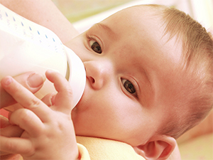 Baby drinking formula milk